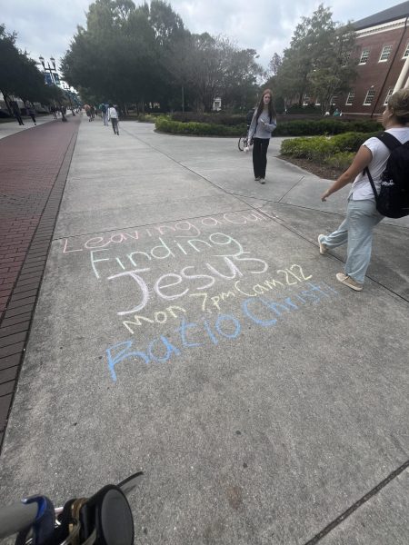 Sidewalk chalk drawing promoting Christian organization Ratio Christi. (Grace McCulloch/The Seahawk).