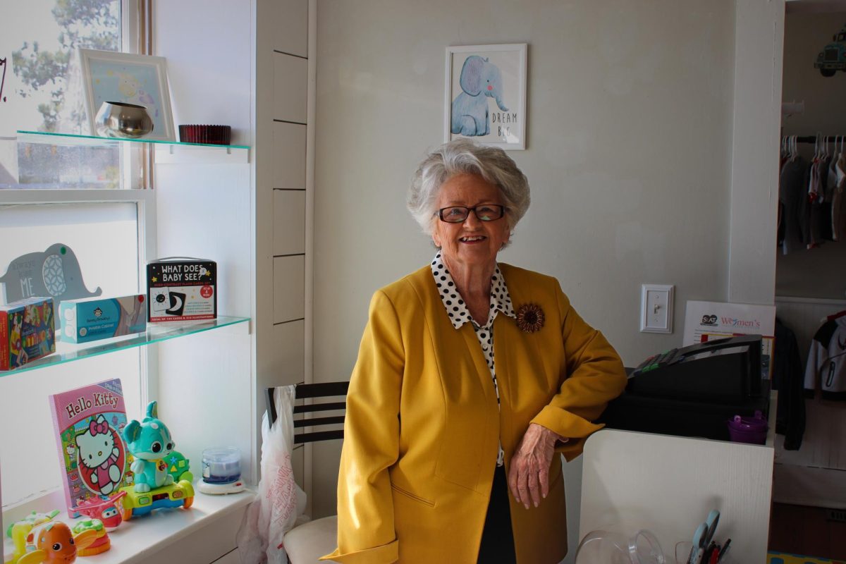 Peggy Sullivan stands at the register of Kidz Kloset in January (Max Matthews/The Seahawk).